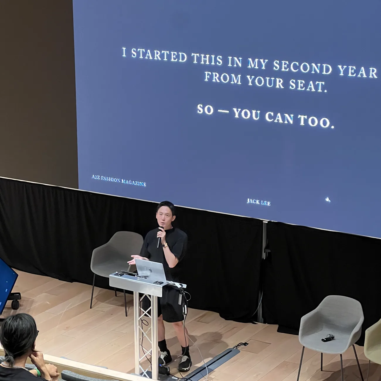 Jack Lee speaking on stage for A2Z Fashion Magazine